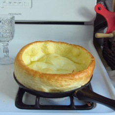 Roger's recipe for Dutch baby pancakes: While skillet is preheating, combine 2 eggs, 1/2 cup milk, 1/2 cup sifted flour, lemon zest, a pinch of salt and 1 tsp vanilla extract. Remove preheated skillet from oven, and turn down heat to 425 degrees F. Melt 2 tablespoons of butter onto the skillet, and then puour your pancake batter into skillet. Remove when golden brown, as pictured.