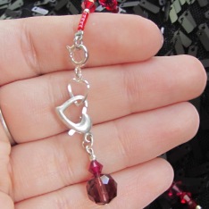 Connect a crystal beaded heart hook up clasp (pomegranate) to one heart at a time to complete your bracelet.